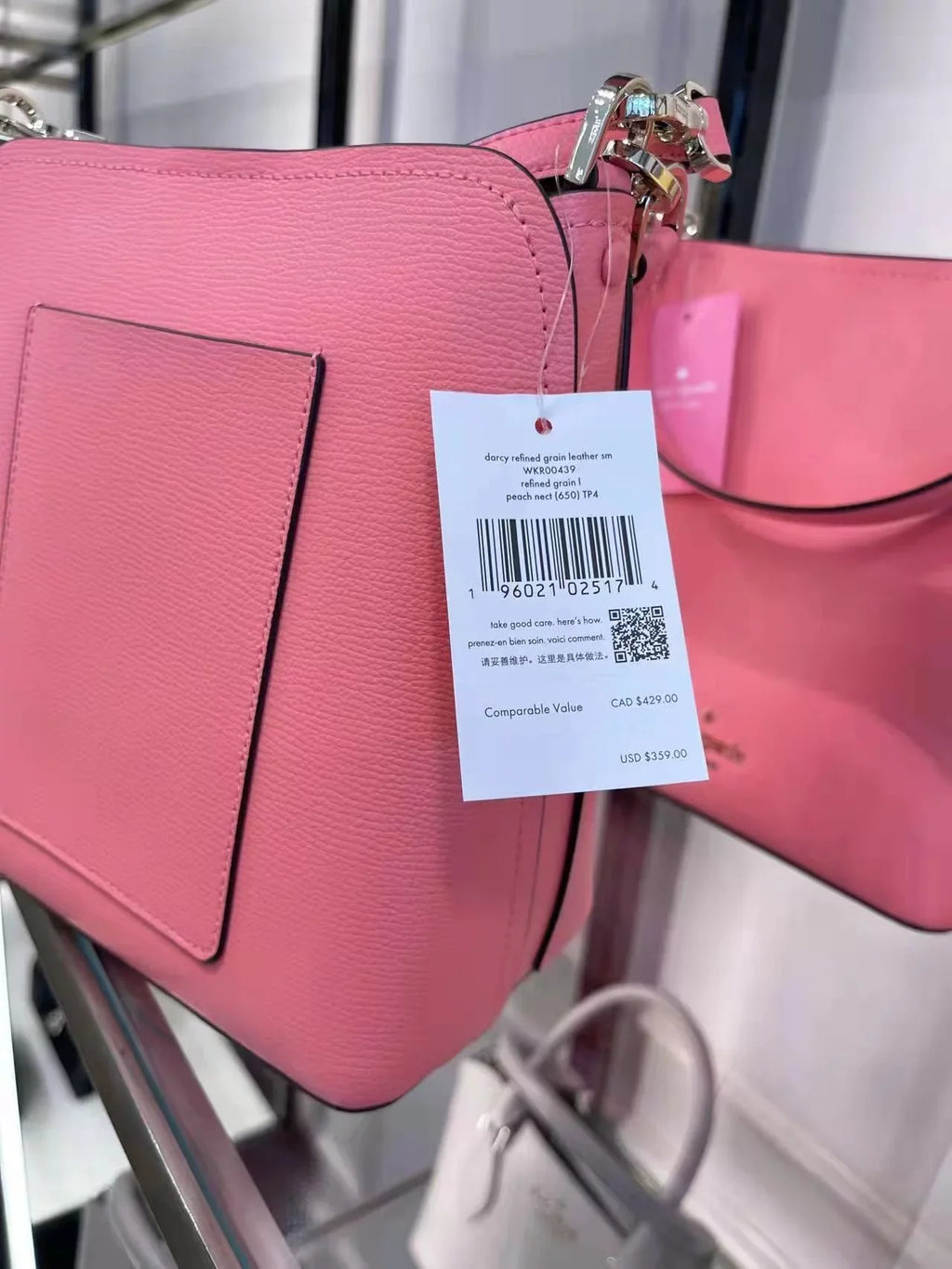 WKR00439 Peach in Kate bag Spade bucket small darcy Nectar